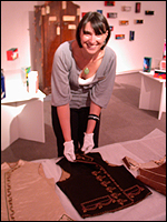  Jo Wiltcher of Tunbridge Wells Museum 
          with an unusual black silk gentleman's embroidered waistcoat